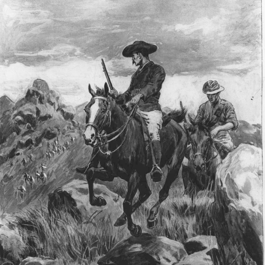 A solitary figure in a long coat stands before a barren tree in a desolate landscape.